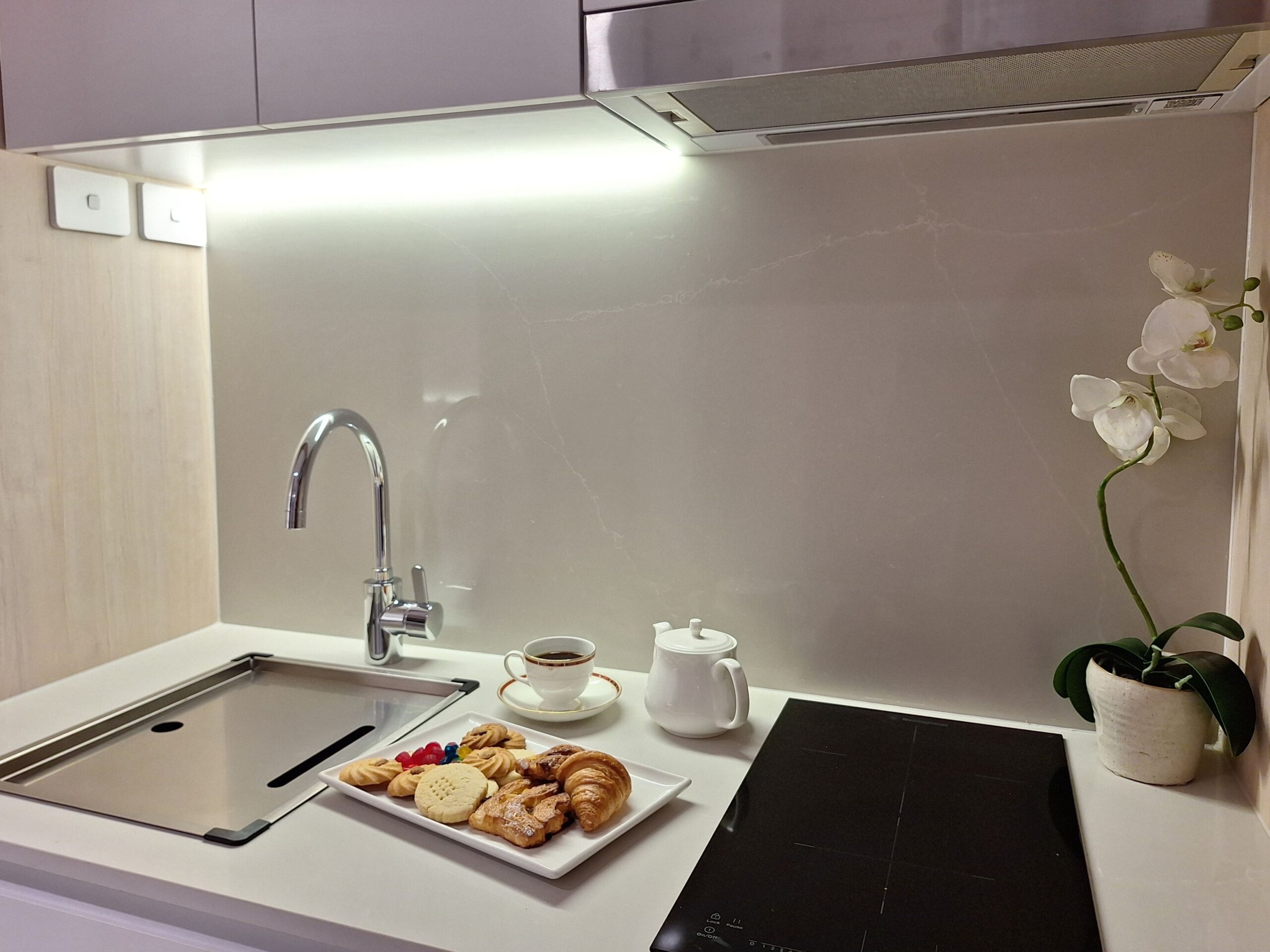 kitchenette with pastries and tea.