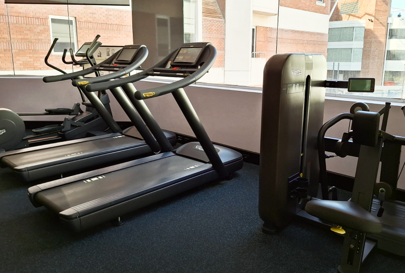 gym with treadmills and equipment
