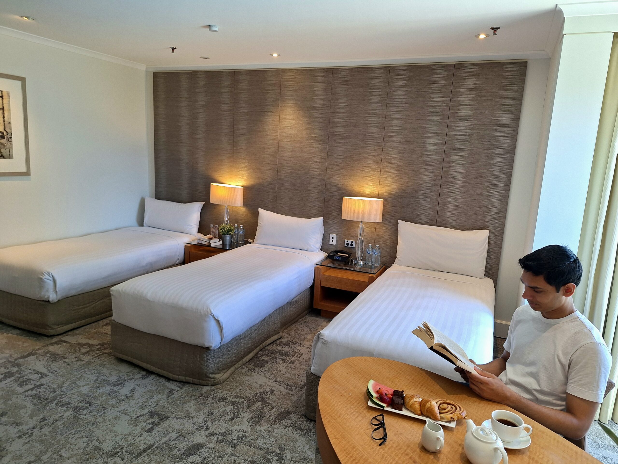 Person reading in 3 bedroom hotel room