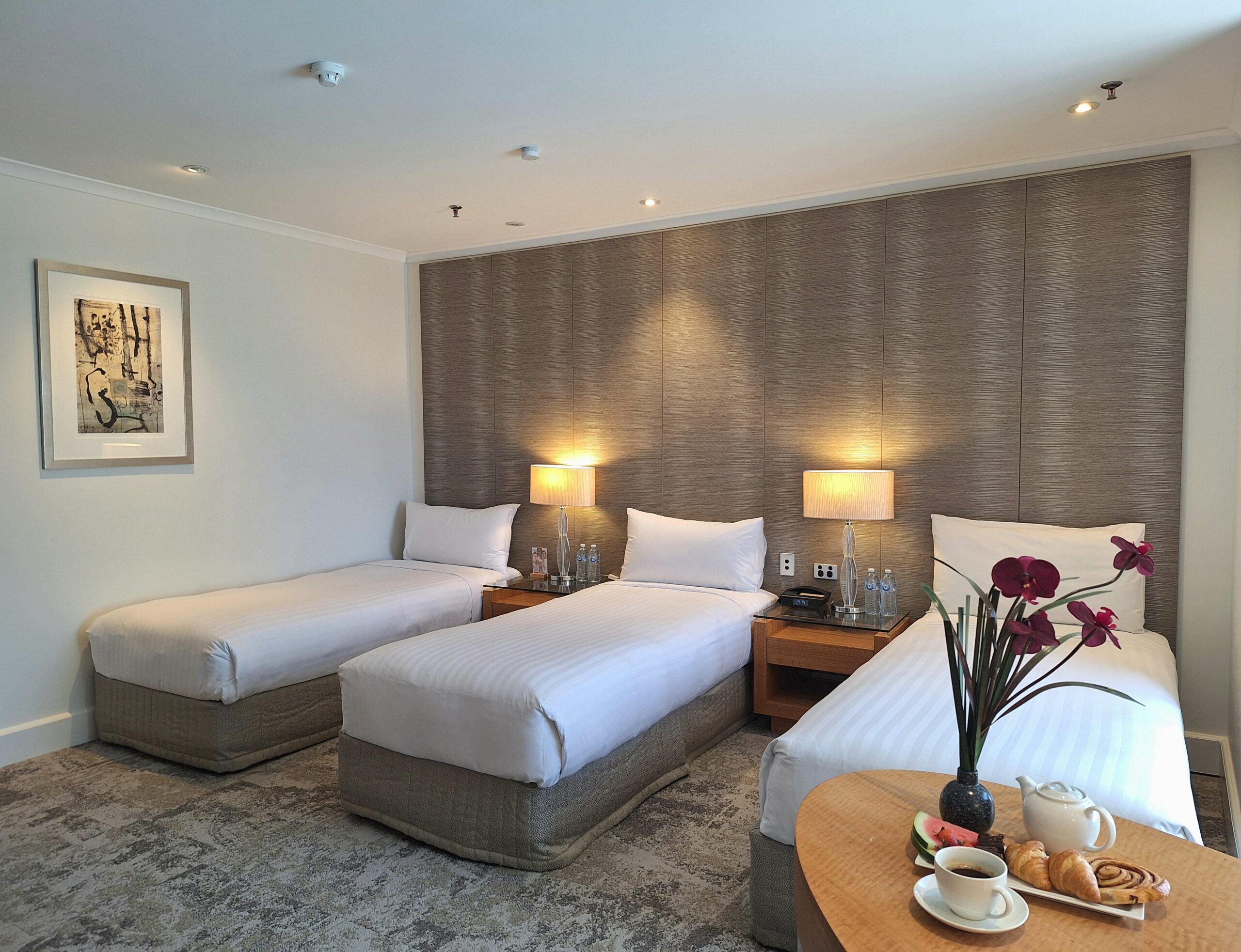 Room with three single beds