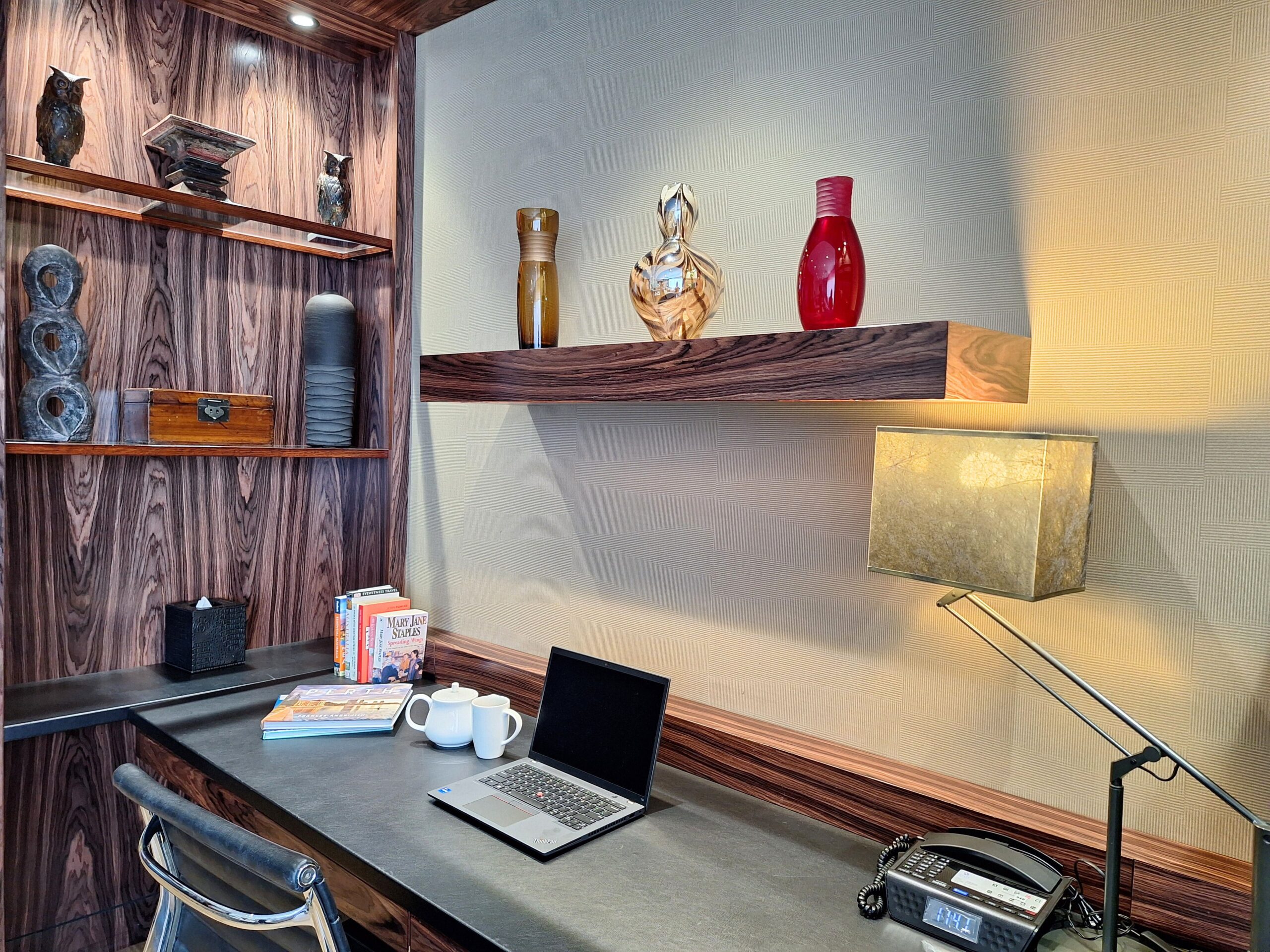 hotel room with wooden shelves